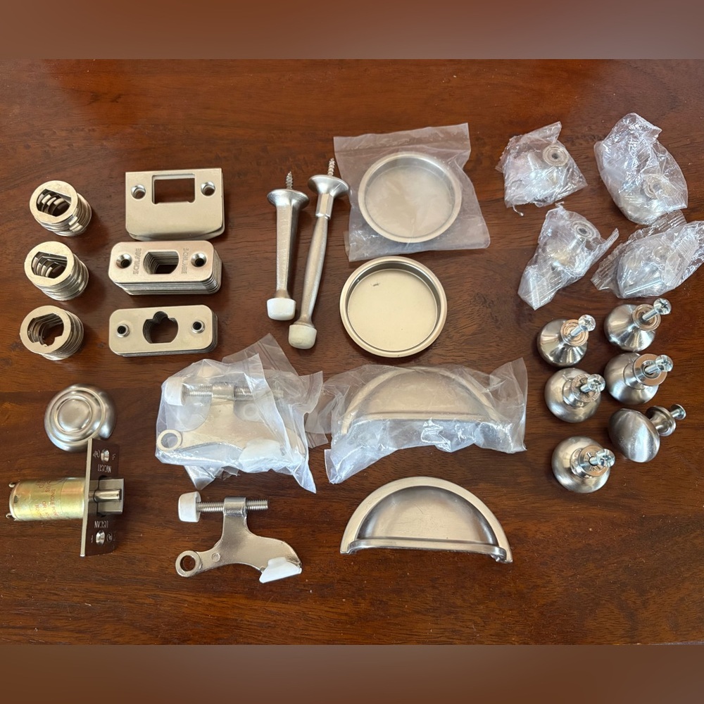 Brushed Nickel Cabinet Knobs, Cup Pulls, & Assorted Hardware.